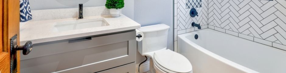 A clean bathroom in a home - does home warranty cover plumbing