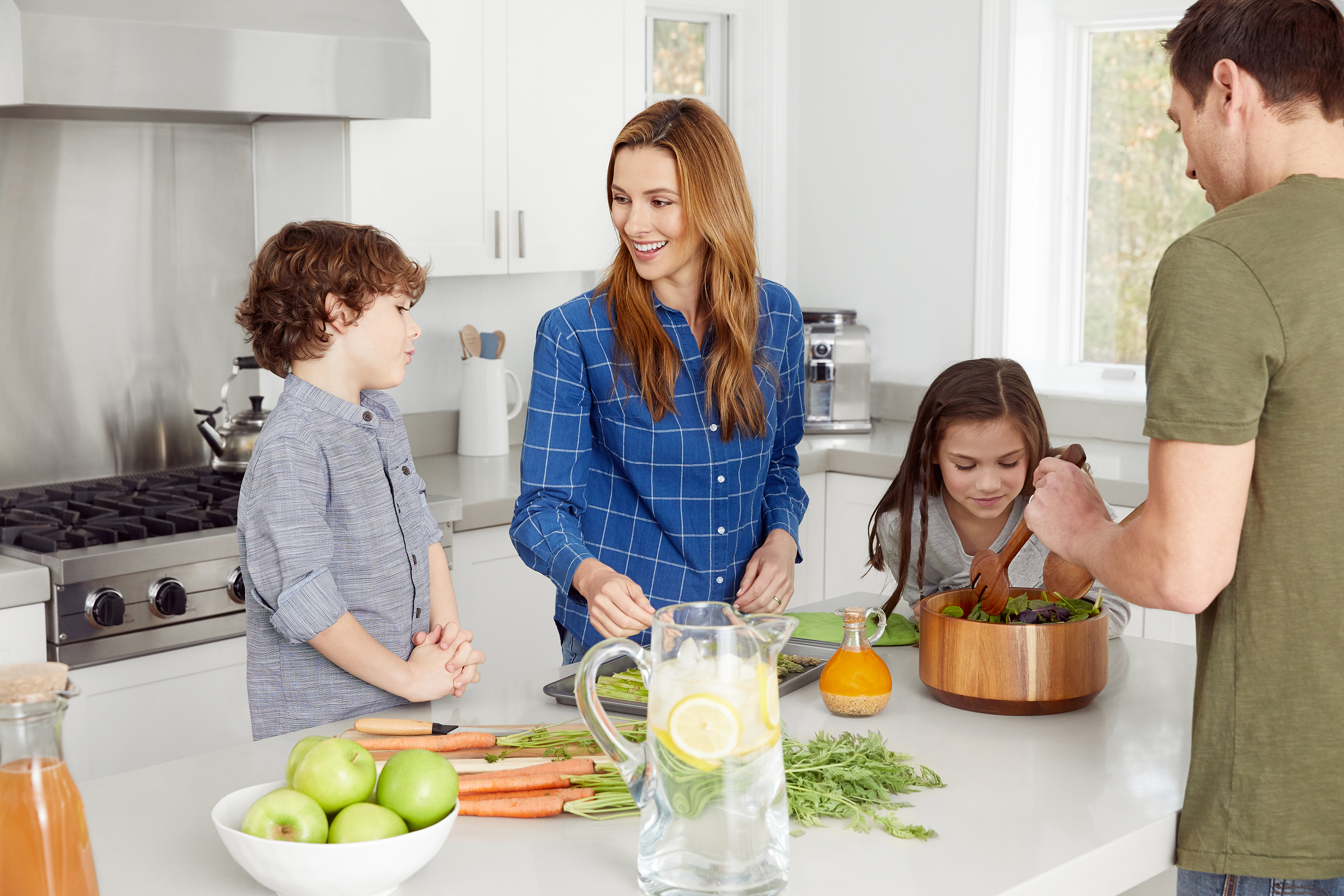 Young family cooking a meal in the kitchen