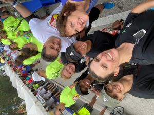 A group of Cinch employees take a selfie preparing to start their run at the 2022 Mercedes-Benz Corporate Run