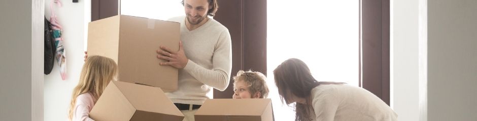 A family of four moving into a new home