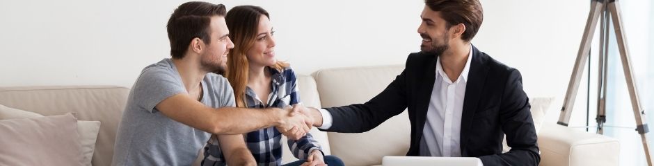 A real estate agent selling a home to a couple