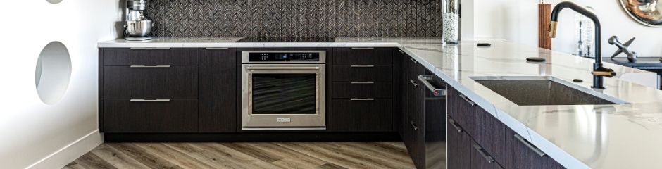 A spotless and modern kitchen in a home - does home warranty cover appliances