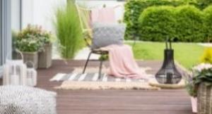 <p>Backyard deck with vases, baskets and area rugs. </p>