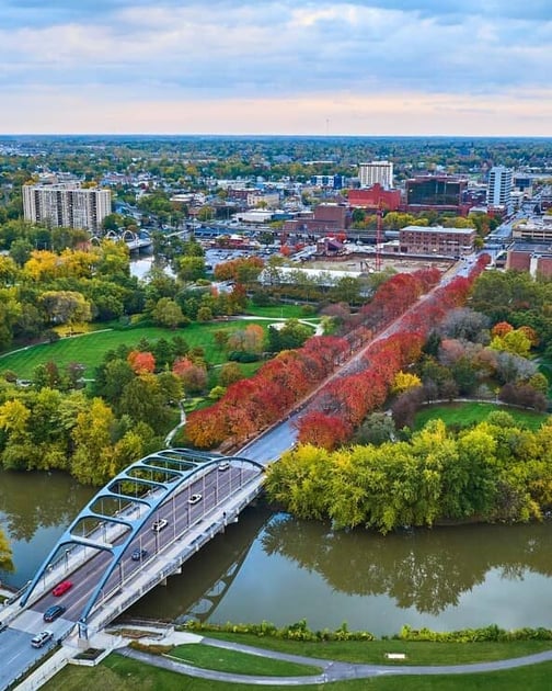 Home warranty in Indiana - Aerial Autumn Cityscape with River Bridge and Skyline, Fort Wayne