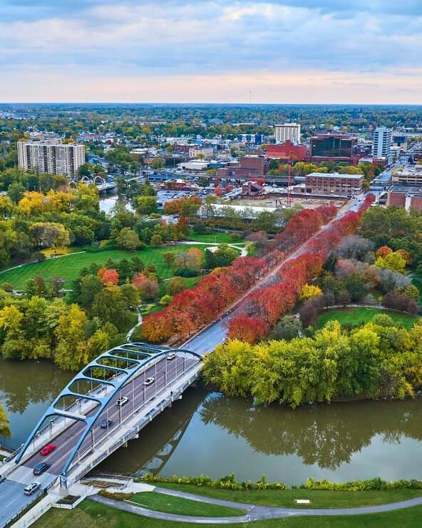 Home warranty in Indiana - Aerial Autumn Cityscape with River Bridge and Skyline, Fort Wayne