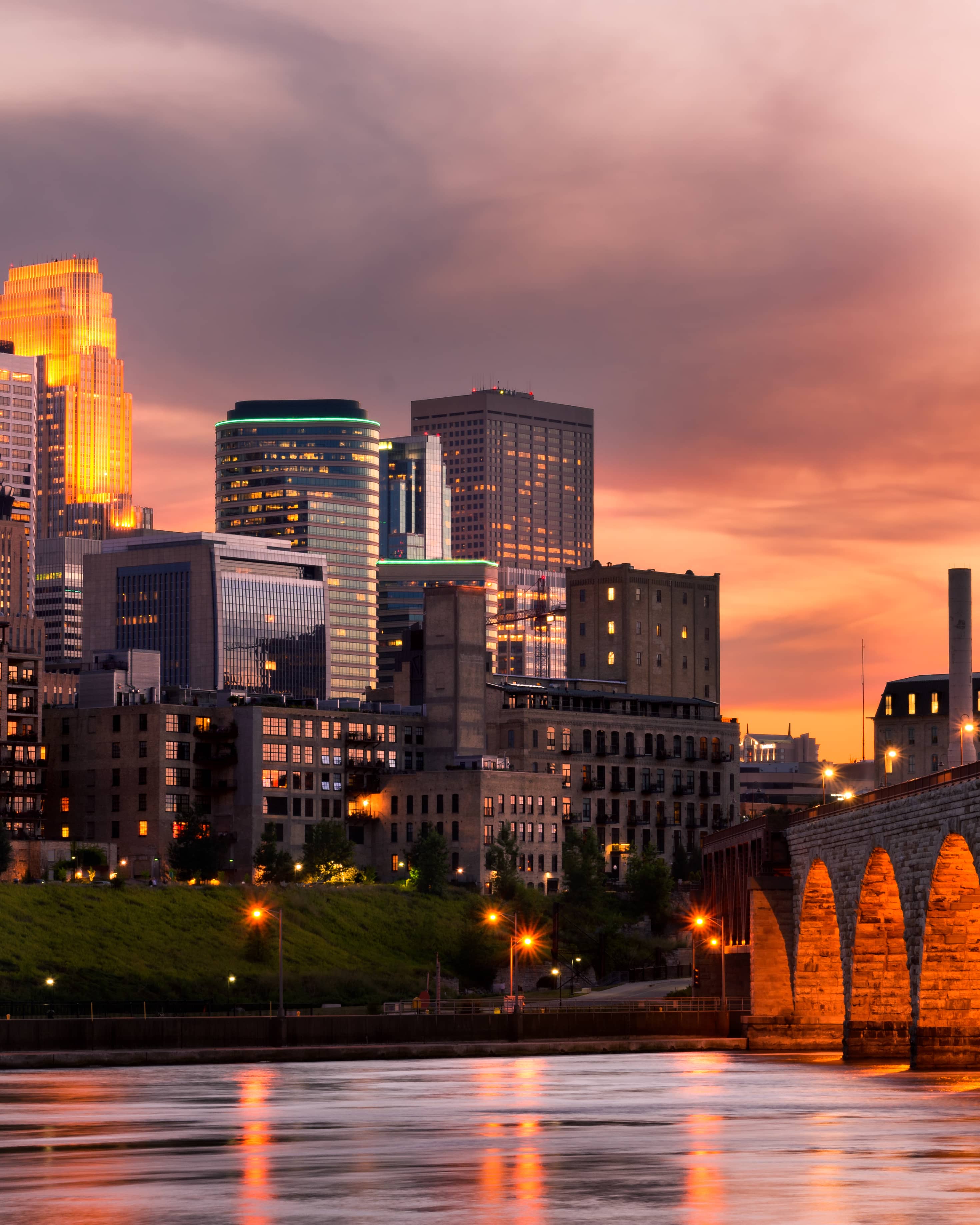 Home warranty in Minnesota - view of bridge, river and skyline at sunset