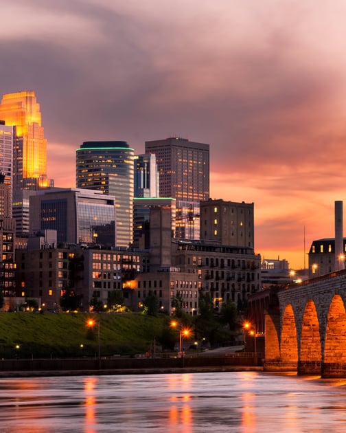 Home warranty in Minnesota - view of bridge, river and skyline at sunset