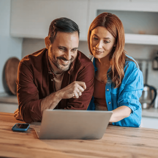 Cinch Home Warranty - Man and woman looking at a laptop