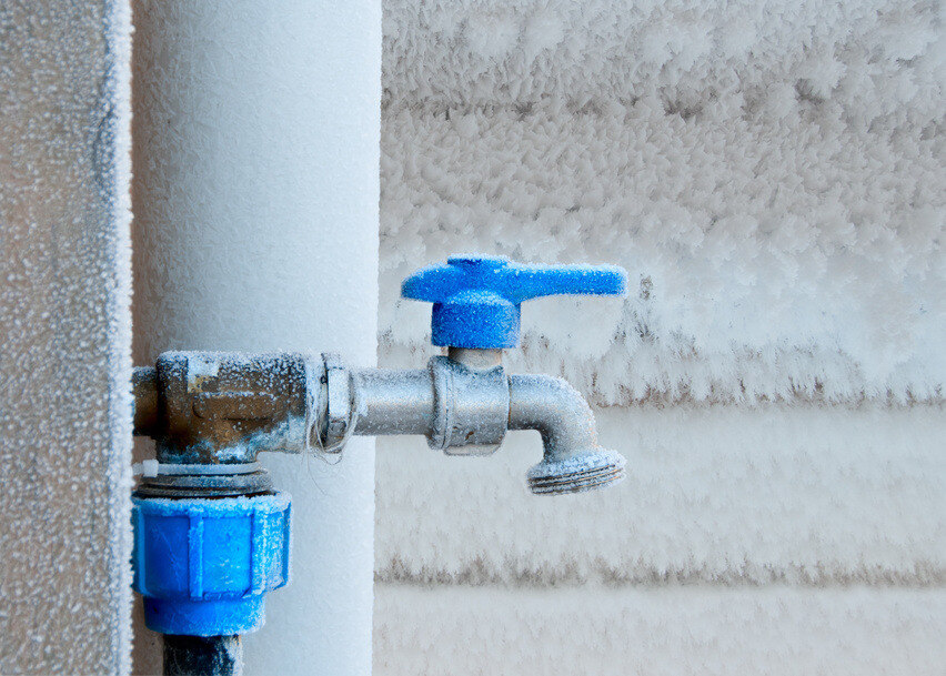 An outside faucet and pipe frozen during winter